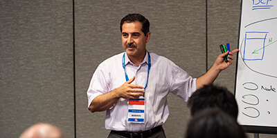 Analysts interacting at event