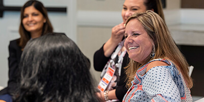 Attendees networking at Gartner conference, fostering meaningful interactions and connections among peers and experts.