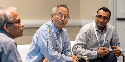 Senior leaders interacting at event