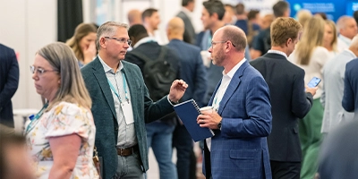 Attendees networking ont he Exhibitor Showfloor