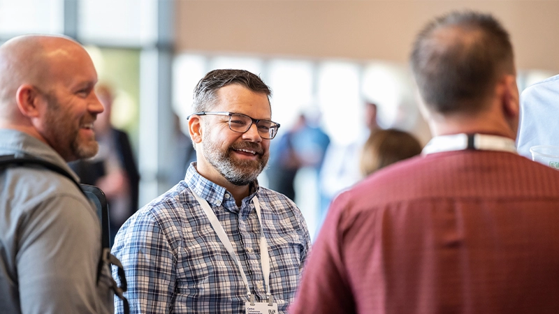 Attendees networking at a Gartner conference