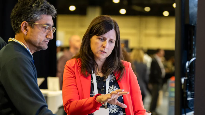 Attendees discussing solutions at Gartner conference, tackling challenges with peers and experts.