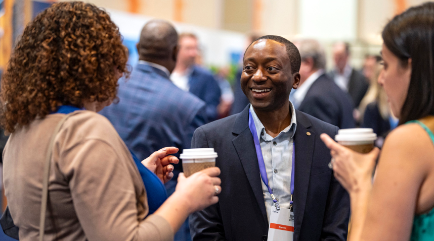 Attendees discussing key takeaways from their sessions as a team at Gartner Finance Symposium/Xpo.