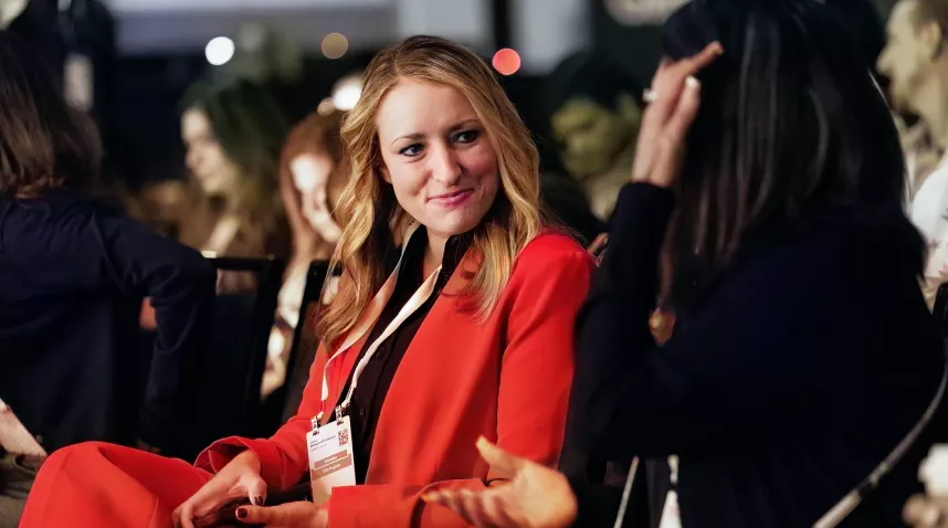 Attendee taking a picture of the stage