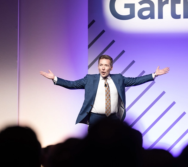 Gartner expert on stage presenting to crowd 