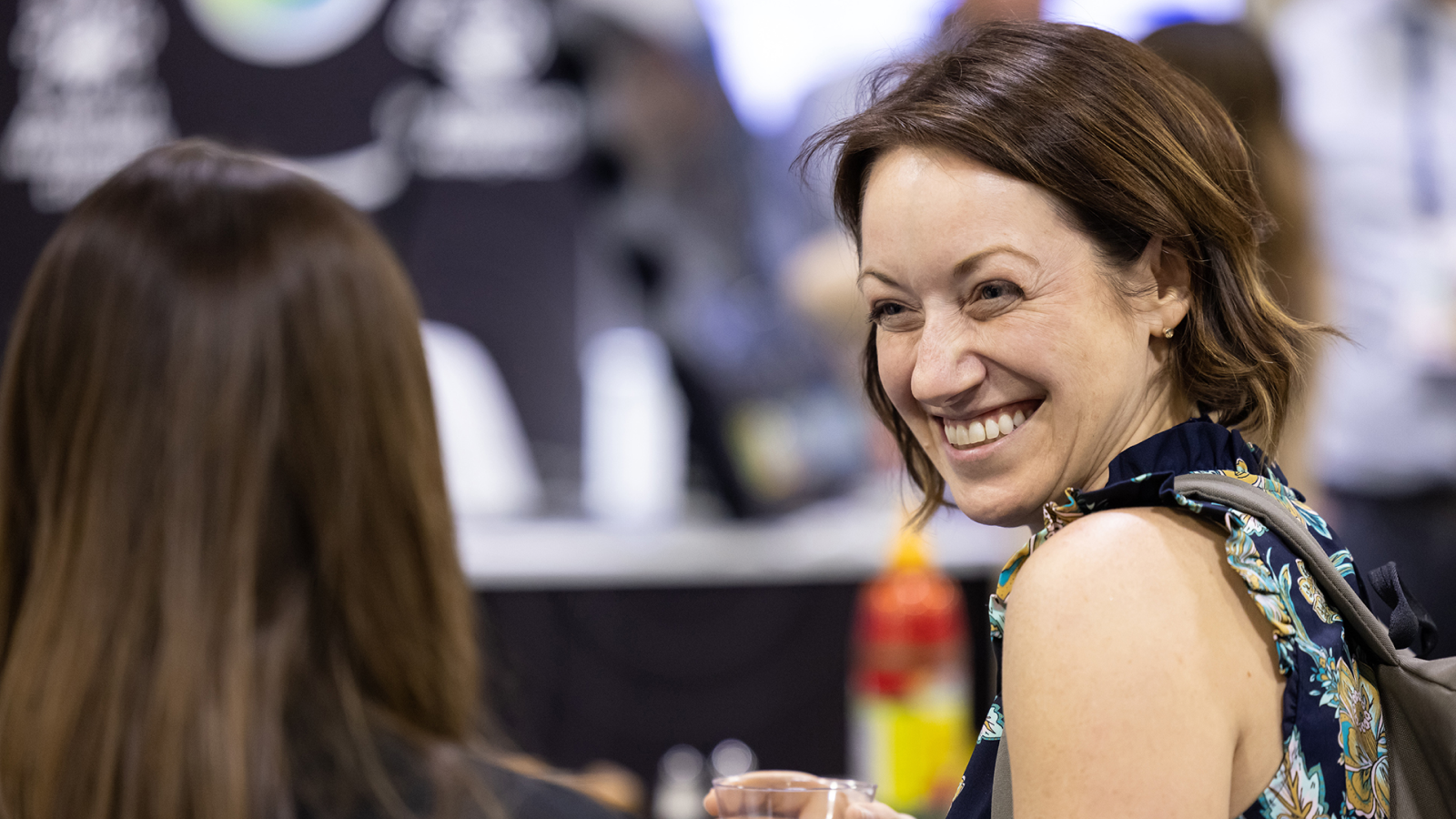 Speaker presenting at Gartner conference, emphasizing data-driven research and expert insights.