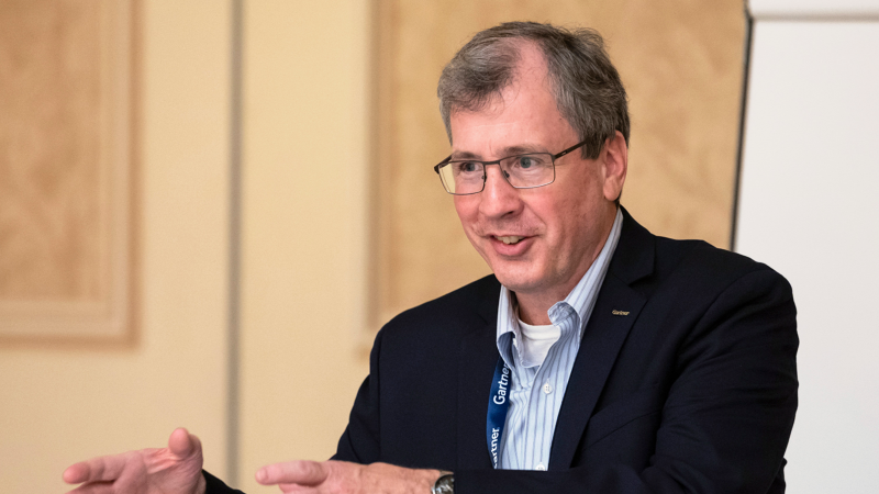 Attendees engaging at Gartner conference, accessing exclusive blockbuster research for competitive advantage.