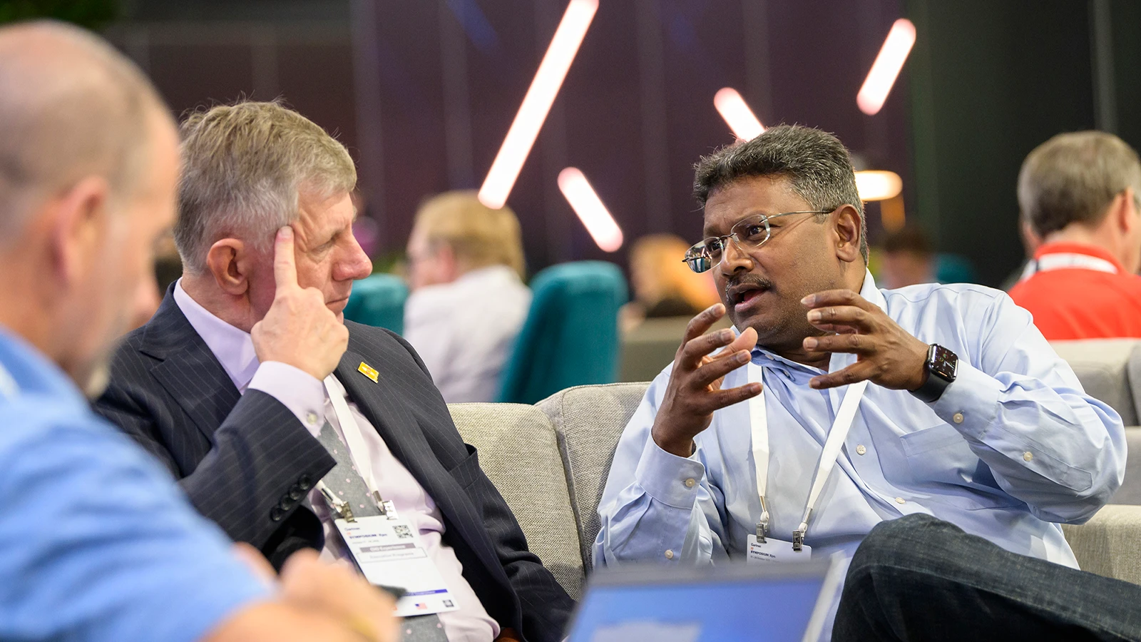 Gartner attendees networking across the conference
