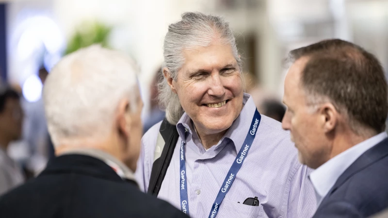 Gartner attendees networking across the conference