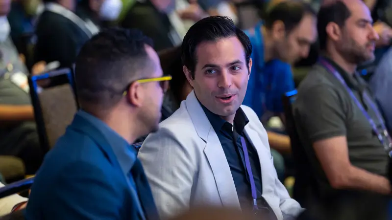 Attendees networking with digital workplace peers at Gartner Digital Workplace Summit, in the audience of a conference session.