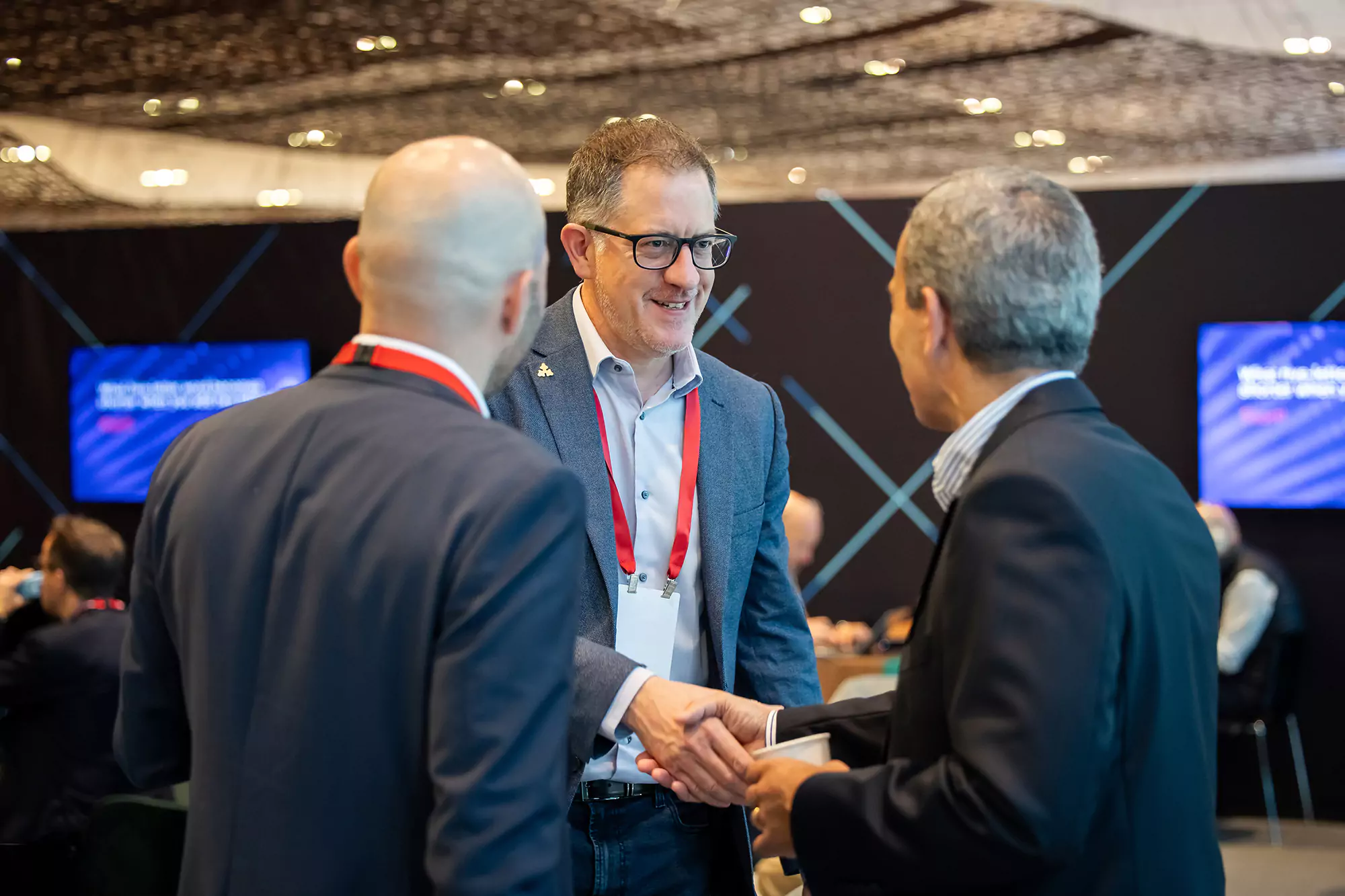 Attendees networking at the conference.