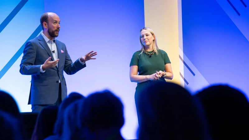 Speaker delivering keynote at Gartner conference, offering visionary insights and innovative perspectives.