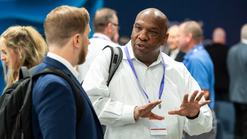 Gartner attendees networking across the conference