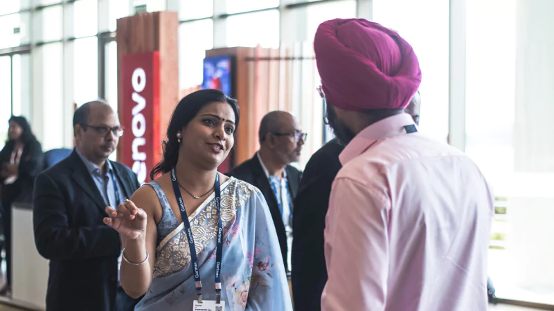 People speaking to each other at a Gartner Conference