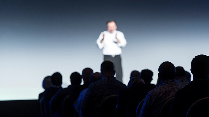 Gartner expert on stage presenting to crowd