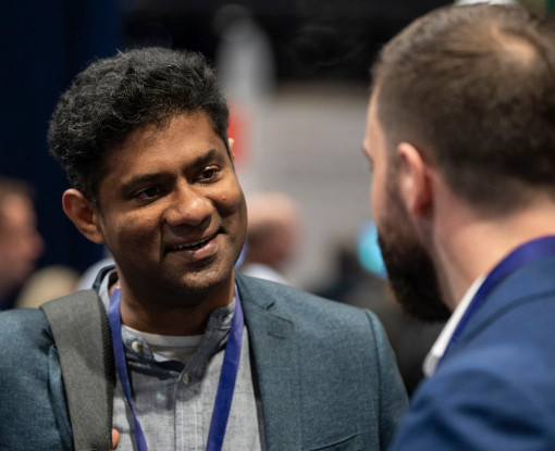 People speaking to each other at a Gartner Conference