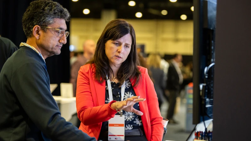 Attendees discussing solutions at Gartner conference, tackling challenges with peers and experts.