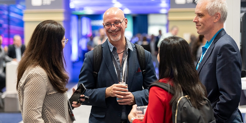 Attendees networking at Gartner conference, fostering meaningful interactions and connections among peers and experts.
