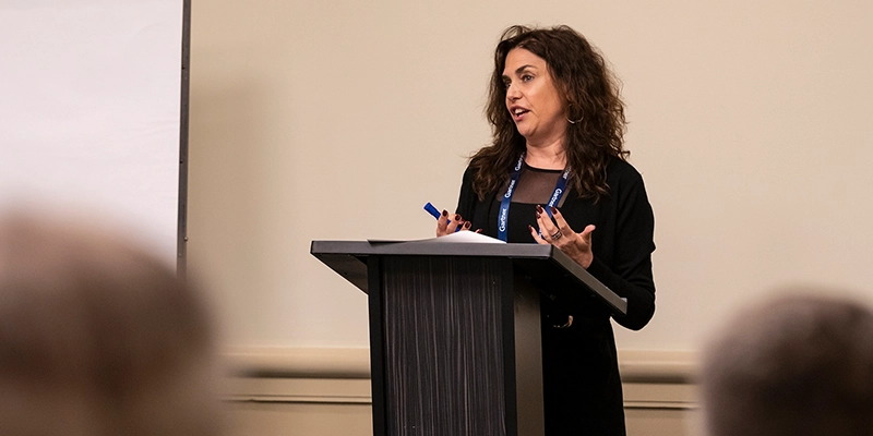Analyst speaking at Gartner conference, offering strategic validation through proprietary research and tools.