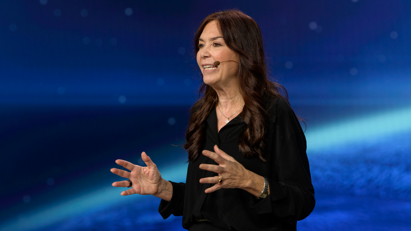 Speaker presenting at Gartner conference, emphasizing data-driven research and expert insights.