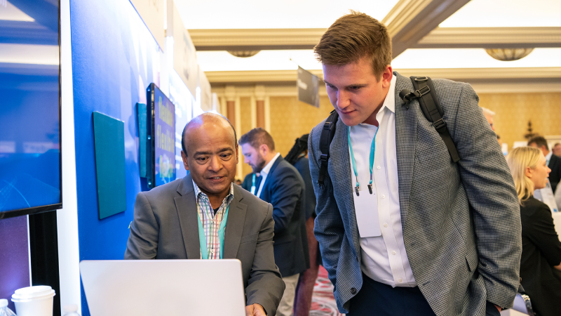 Two people discussing a 30-, 60-, and 90-day action plan to tackle major HR challenges