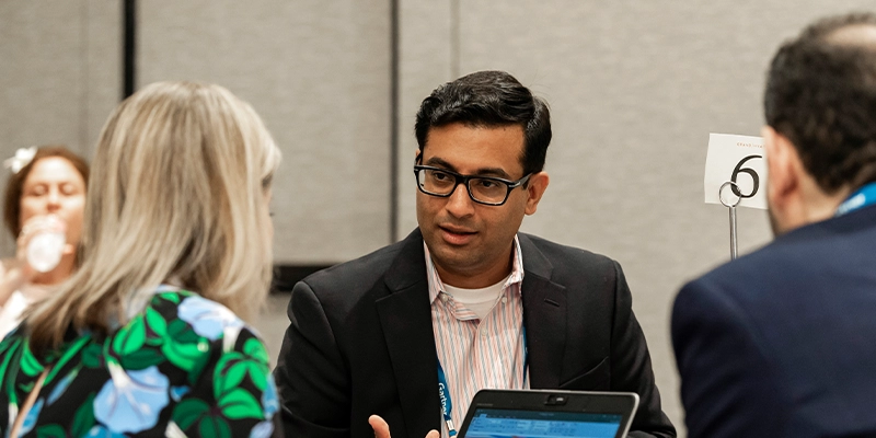Attendees networking at Gartner conference, fostering meaningful interactions and connections among peers and experts.
