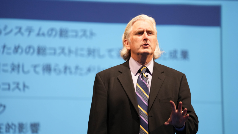 Speaker delivering keynote at Gartner conference, offering visionary insights and innovative perspectives.