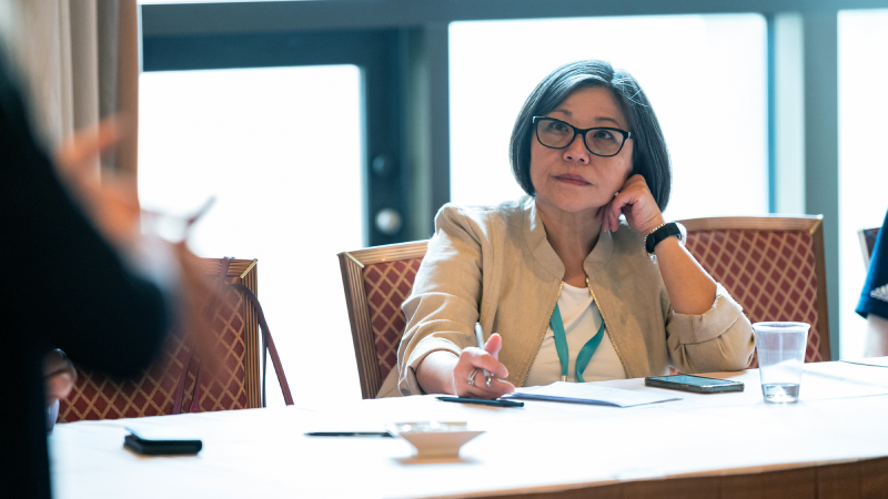 Attendees discussing solutions at Gartner conference, tackling challenges with peers and experts.