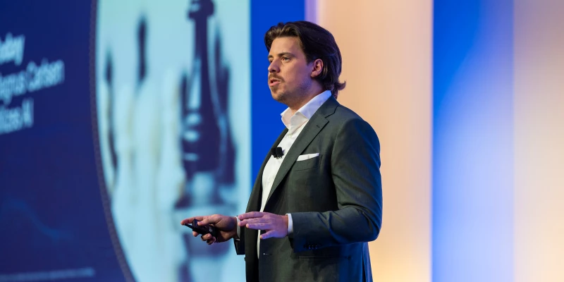 Speaker presenting at Gartner conference, emphasizing data-driven research and expert insights.