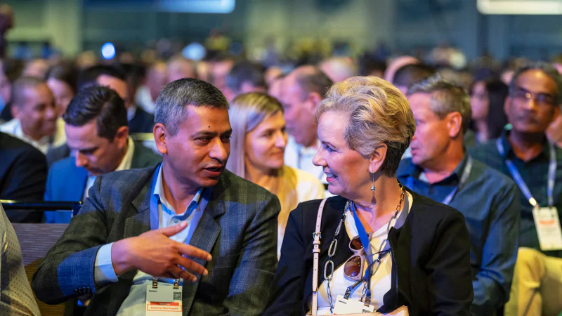 Attendees networking at Gartner conference, fostering meaningful interactions and connections among peers and experts.