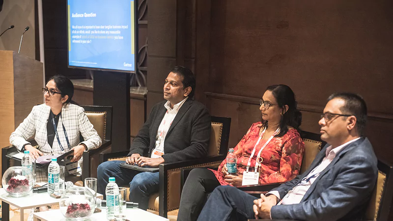 Speaker delivering keynote at Gartner conference, offering visionary insights and innovative perspectives.