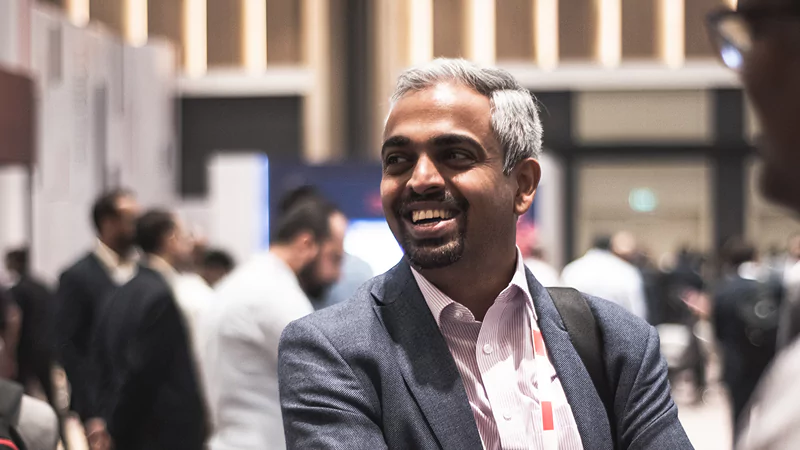 Attendees discussing solutions at Gartner conference, tackling challenges with peers and experts.