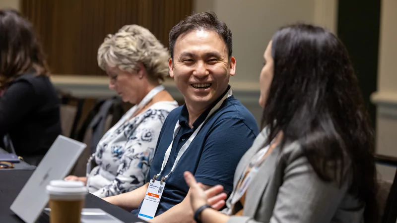 Attendees networking with finance peers before a session at Gartner CFO & Finance Executive Conference