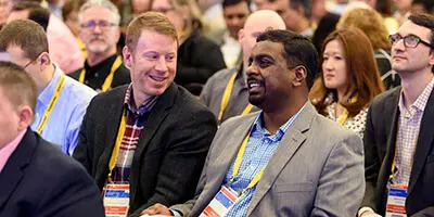 Attendees engaging at Gartner conference, accessing exclusive blockbuster insights for competitive advantage.