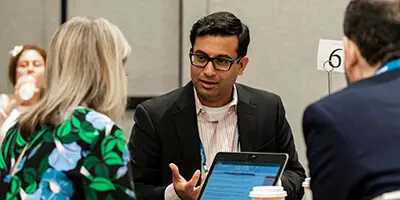 Industry leaders collaborating at Gartner conference to solve shared challenges and make informed decisions.