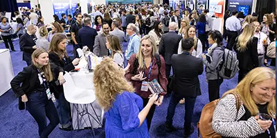 Attendees discussing solutions at Gartner conference, tackling challenges with peers and experts.