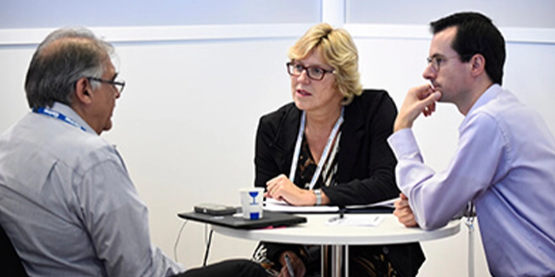 Attendees discussing solutions at Gartner conference, tackling challenges with peers and experts.