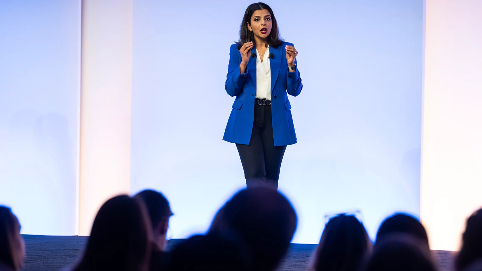 Speaker presenting at Gartner conference, emphasizing data-driven research and expert insights.