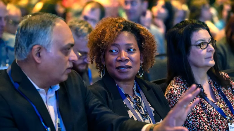 Speaker delivering keynote at Gartner conference, offering visionary insights and innovative perspectives.