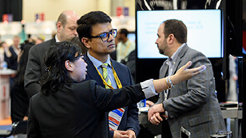 Attendees viewing an Exhibitor showcase