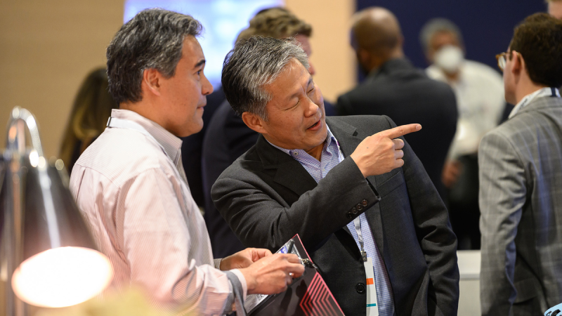 Gartner Apps Summit attendee smiling interacting with vendor