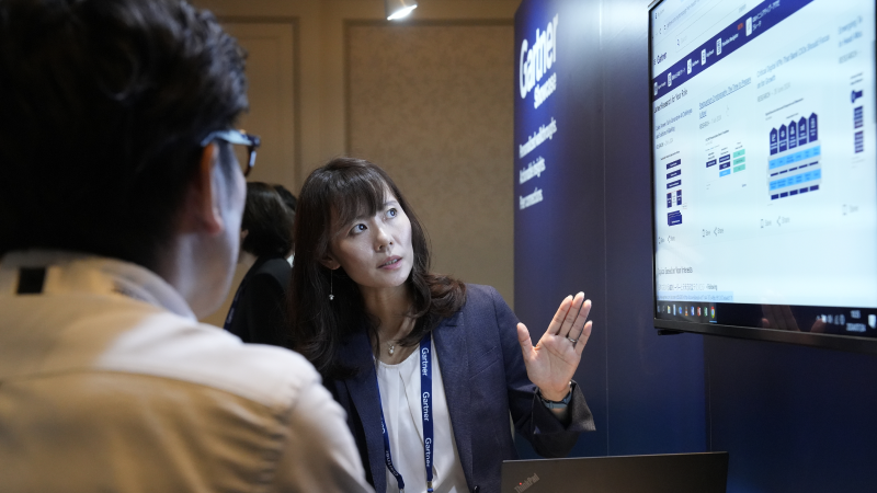 Attendees engaging at Gartner conference, accessing exclusive blockbuster research for competitive advantage.