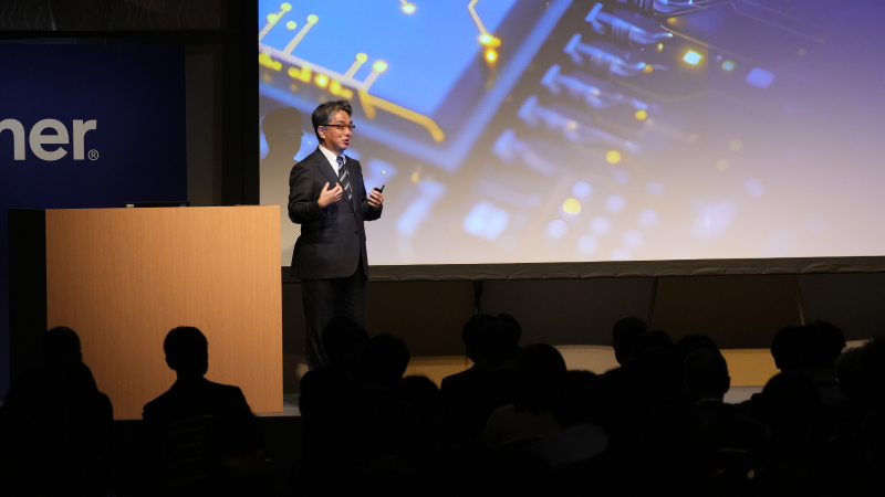 Speaker delivering keynote at Gartner conference, offering visionary insights and innovative perspectives.