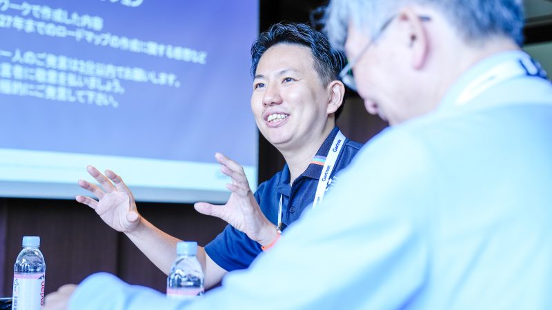 Attendees discussing solutions at Gartner conference, tackling challenges with peers and experts.