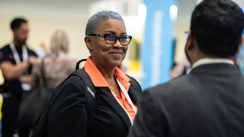 Attendees networking at Gartner conference, fostering meaningful interactions and connections among peers and experts.