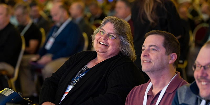 Attendees engaging at Gartner conference, accessing exclusive blockbuster research for competitive advantage.