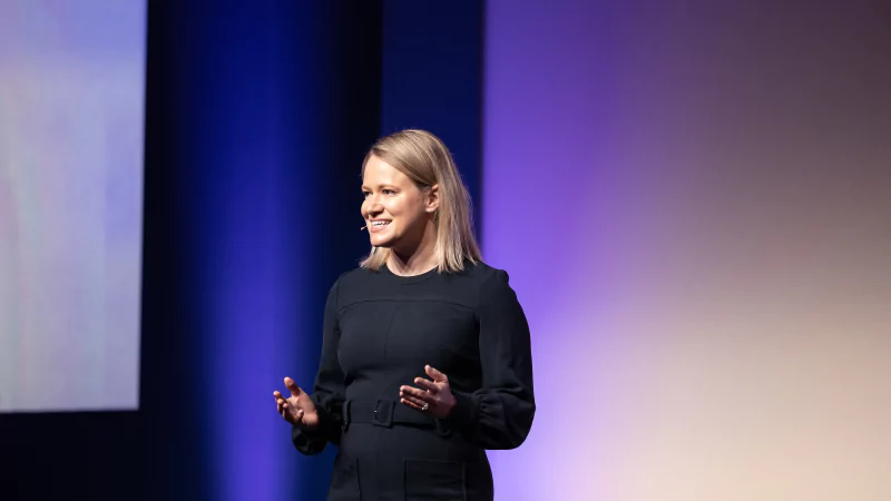 Speaker presenting at Gartner conference, emphasizing data-driven research.