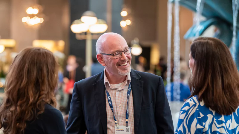 Attendees networking at Gartner conference, fostering meaningful interactions and connections among peers and experts.
