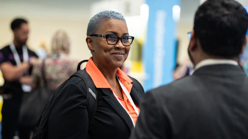 Attendees networking at Gartner conference, fostering meaningful interactions and connections among peers and experts.