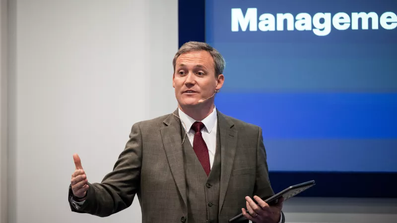 Expert speaking at Gartner conference, offering strategic validation through proprietary research and tools.